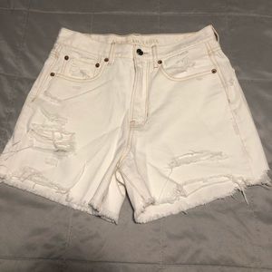 Cream distressed AE shorts
